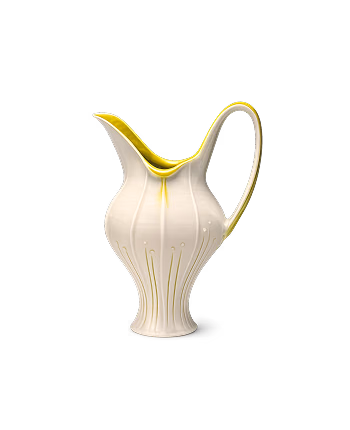 A fluted white pitcher with yellow glaze on the rim and handle